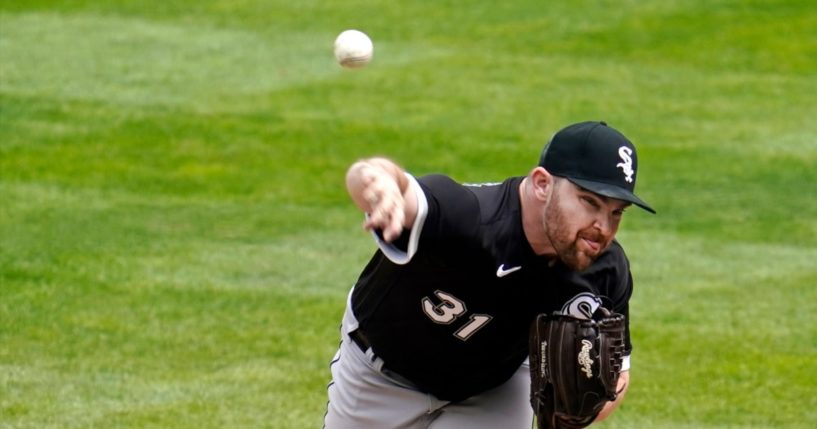 Chicago White Sox pitcher Liam Hendriks throws against the Minnesota Twins in the ninth inning of a game in May 2021.