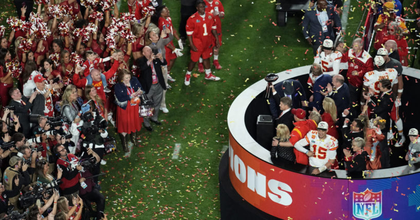 Kansas City Chiefs general manager Brett Veach holding the Vince Lombardi Trophy after Super Bowl 57