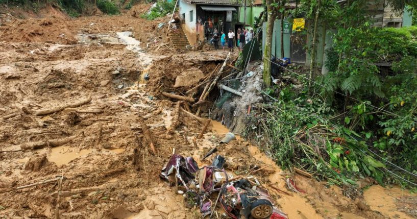 A crumpled vehicle lies in the mud after a deadly landslide triggered by heavy rains destroyed the area near Juquehy beach in the coastal city of Sao Sebastiao, Brazil, on Monday.