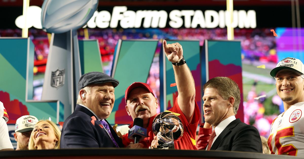 Head coach Andy Reid and CEO Clark Hunt of the Kansas City Chiefs celebrate with the Vince Lombardi Trophy after defeating the Philadelphia Eagles 38-35 in Super Bowl LVII at State Farm Stadium on Sunday in Glendale, Arizona.