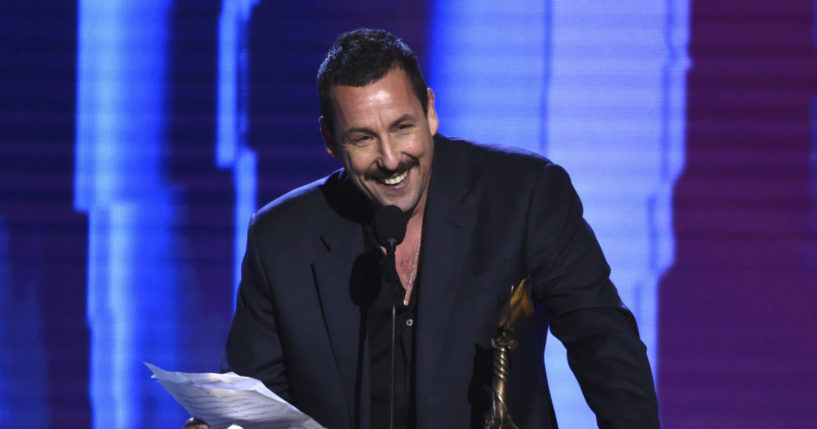 Adam Sandler accepting an award