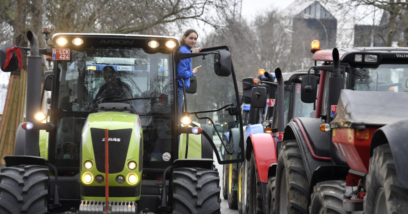 Belgian farmers block traffic with their tractors on a road in the center of Brussels during a demonstration Friday. Hundreds of tractors were driven there by angry farmers protesting a plan to cut nitrate levels.