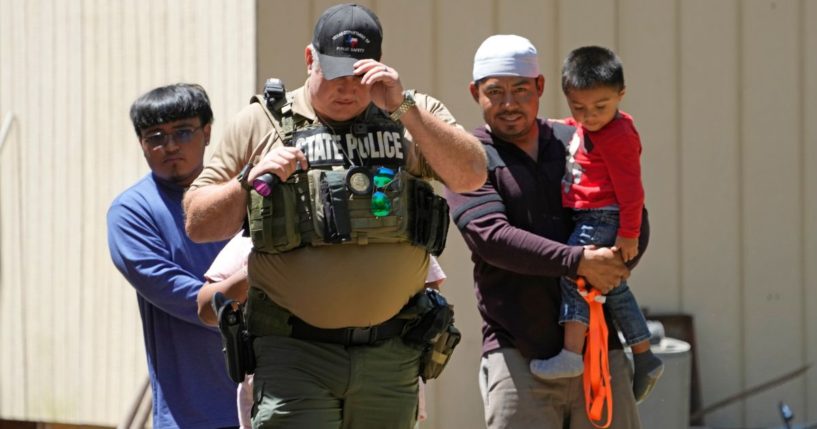 A law enforcement official works Sunday in the neighborhood where a mass shooting occurred Friday night, in Cleveland, Texas.