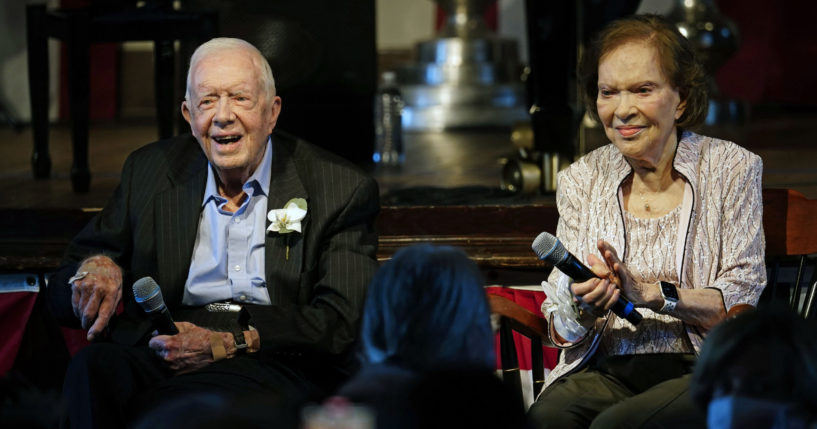 Former President Jimmy Carter and his wife, Rosalynn Carter, sit together during a reception to celebrate their 75th wedding anniversary in Plains, Georgia, on July 10, 2021.