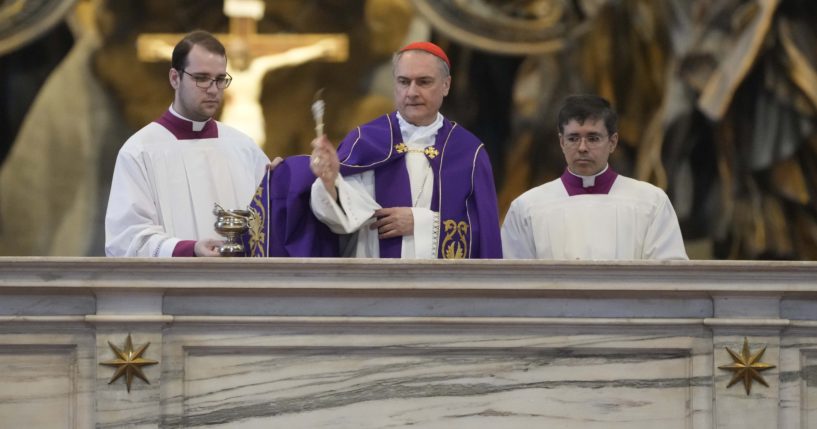 Cardinal Mauro Bassetti, center, blesses the altar of the confession during a penitential rite inside St. Peter's Basilica Saturday.