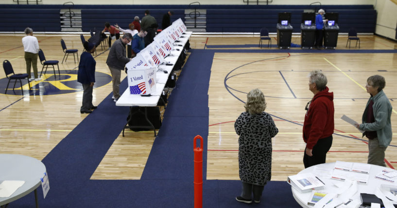 Voters fill out their ballots at a primary polling place in North Charleston, South Carolina, on Feb. 29, 2020.