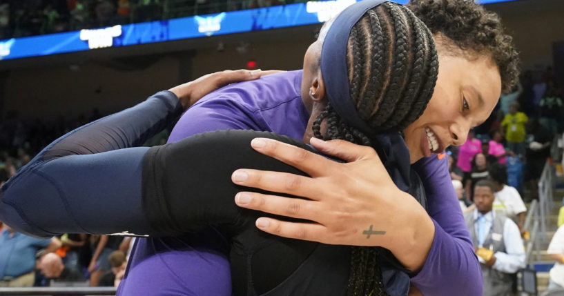 Brittney Griner, right, hugs former college teammate Odyssey Sims, left, after a WNBA basketball basketball game in Arlington, Texas, on Friday.