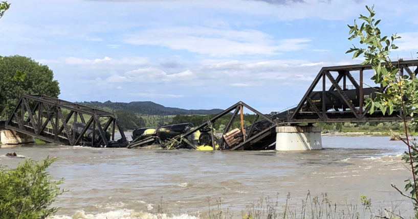 Several train cars are immersed in the Yellowstone River after a bridge collapse near Columbus, Montana, on Saturday.