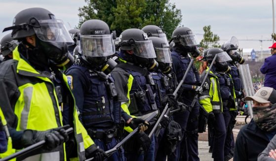 Capitol Hill police stand in front of protesters outside the U.S. Capitol in Washington, D.C., for the "Stop the Steal" rally on Jan. 6, 2021.