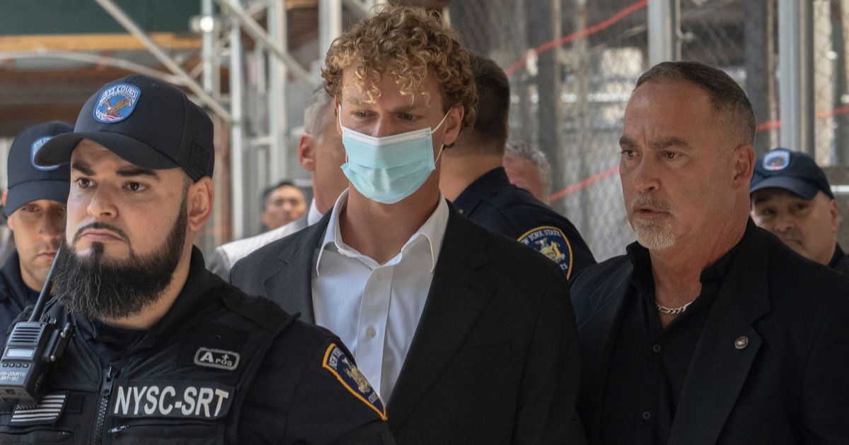 Kyle Penny, center, leaves Manhattan Criminal Court in New York City on May 12.