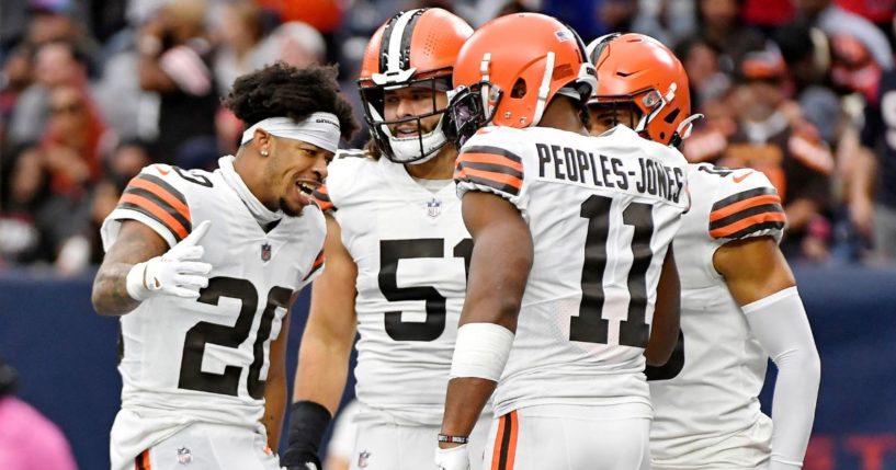 Greg Newsome II, left, celebrates with Donovan Peoples-Jones, right, and other Cleveland Browns teammates after Peoples-Jones' punt return for a touchdown against the Houston Texans at NRG Stadium on Dec. 4, 2022.