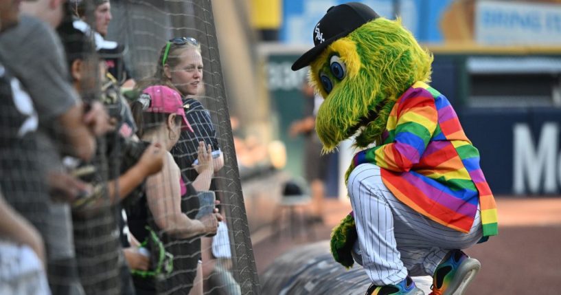 Chicago White Sox mascot Southpaw, dressed in rainbow colors for LGBT "pride night," meets with fans before a game against the Baltimore Orioles at Guaranteed Rate Field in Chicago on June 23, 2022.