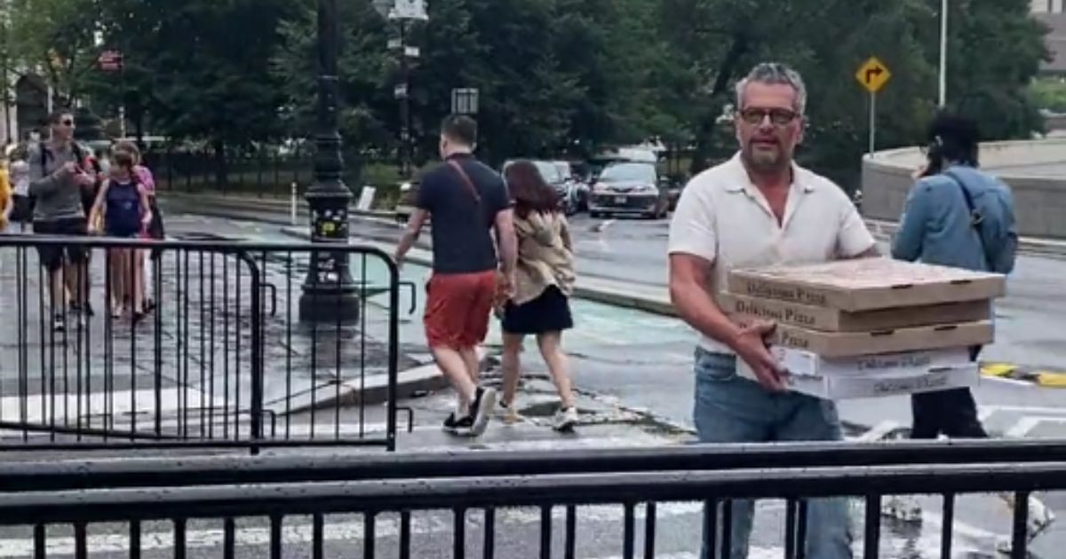 New Yorker Scott LoBaido took to the streets of New York outside of New York City Hall to protest the new regulations on coal and wood-fired pizza ovens, chanting "Give us pizza, or give us death."