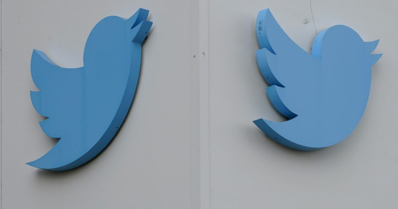 Twitter logos hang outside the company's offices in San Francisco in December. Ella Irwin, Twitter's head of trust and safety, has left the company.