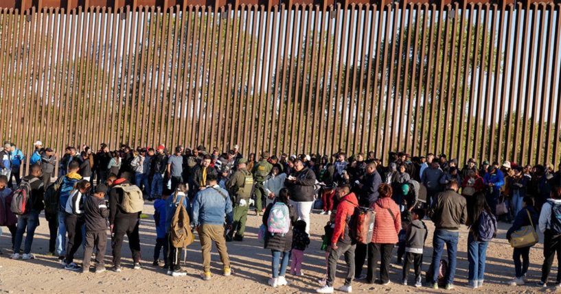 Migrants attempting to illegally enter the U.S. from Mexico are detained by U.S. Customs and Border Protection at the border on May 6 in San Luis, Arizona.