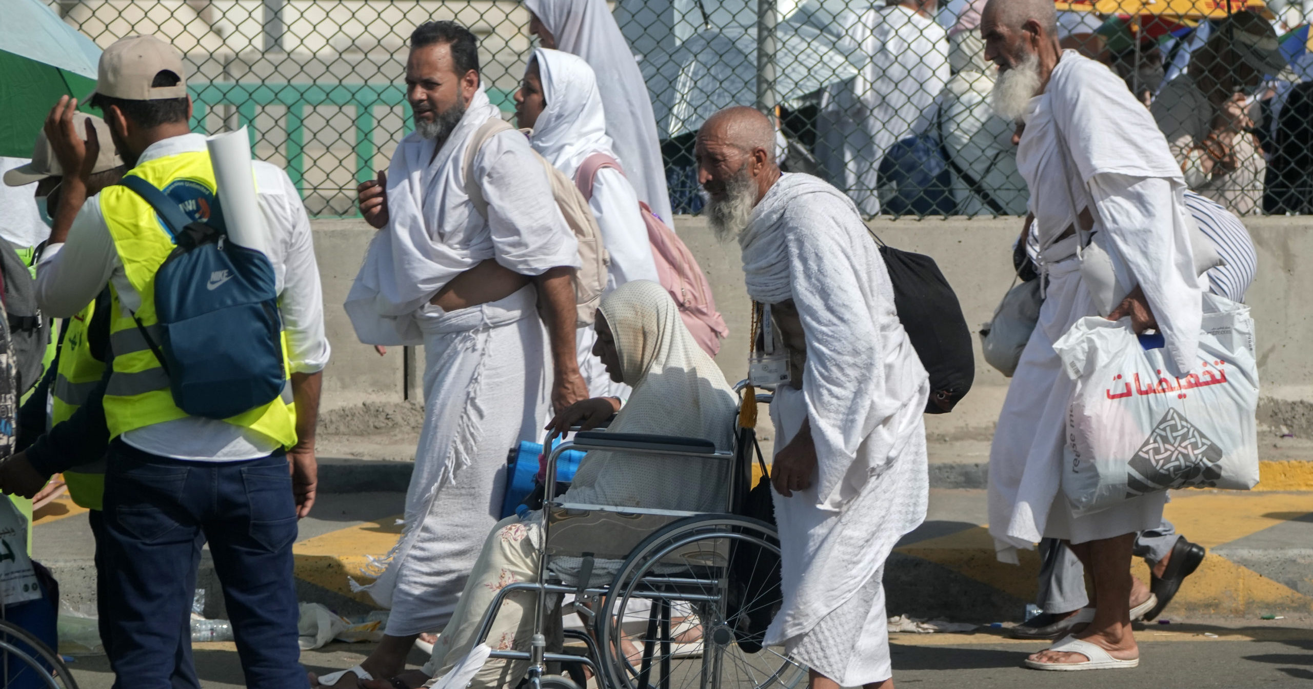 Muslim pilgrims walk at the Mina tent camp near Mecca, Saudi Arabia, on Wednesday during the Hajj.