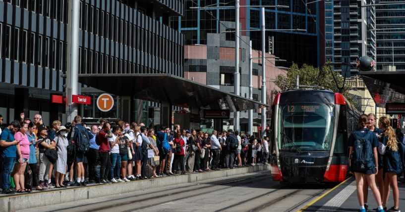 Commuters wait for light rail service at Town Hall Station on March 8, 2023 in Sydney, Australia.