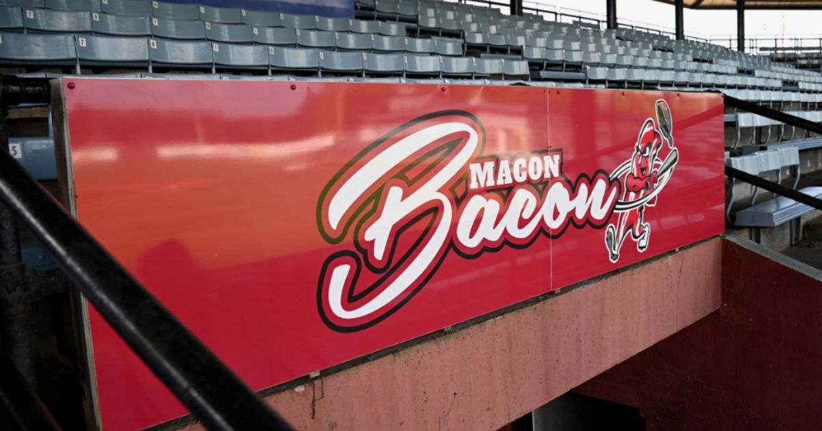 The logo for the Macon Bacon baseball team name is displayed on a sign at Luther Williams Field in Macon, Georgia, on May 24, 2022.