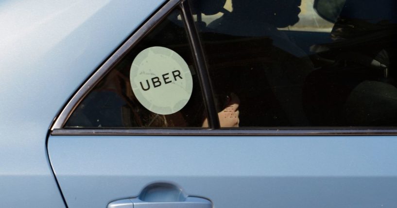 An Uber driver and car with passengers in Washington, D.C.