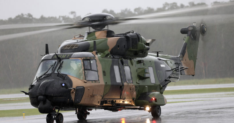 In this photo provided by the Australian Defence Force, an Australian Army MRH-90 Taipan helicopter prepares to take off from the airport in Ballina, Australia, on Feb. 27, 2022.