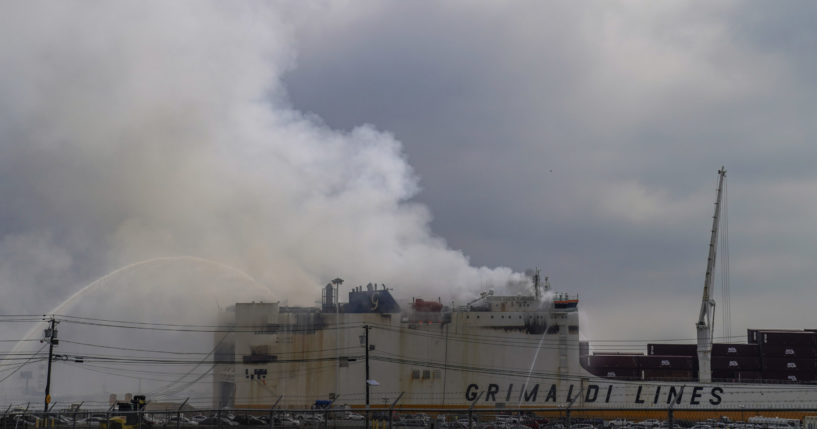 Emergency personnel battle a fire aboard the Italian-flagged Grande Costa d'Avorio cargo ship at the Port of Newark in New Jersey on Friday.