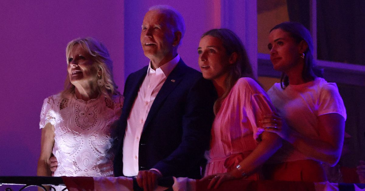 First lady Jill Biden, left, President Joe Biden, middle left, and their granddaughters, Finnegan Biden and Naomi Biden, watch fireworks from the White House on Tuesday.