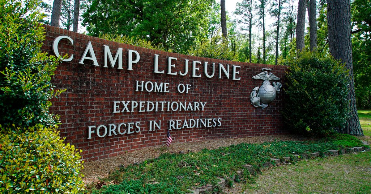 A sign for Camp Lejeune is displayed outside the main gate to Camp Lejeune Marine Base near Jacksonville, North Carolina.