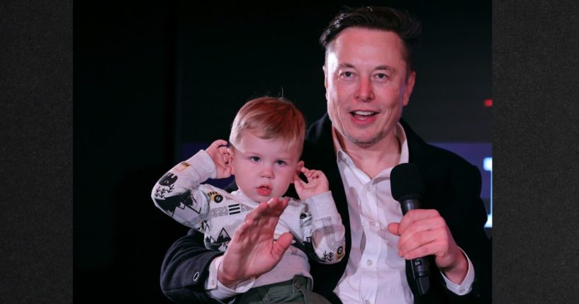 Elon Musk and son X Æ A-12 ("X" for short) are pictured in December 2021. Musk appeared to hint in a recent tweet that he would support voting rights being restricted to those with children