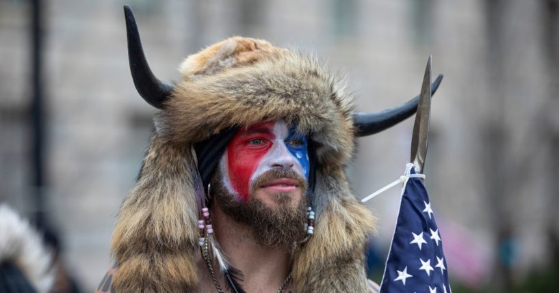 Jacob Chansley, also known as the "QAnon Shaman," speaks to passersby during the "Stop the Steal" rally on Jan.6, 2021, in Washington, D.C.