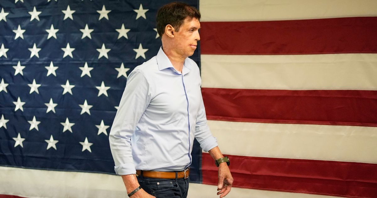 Nevada Republican Senate hopeful Sam Brown, a retired Army captain and Purple Heart recipient, walks through his campaign office in Las Vegas on June 14, 2022.