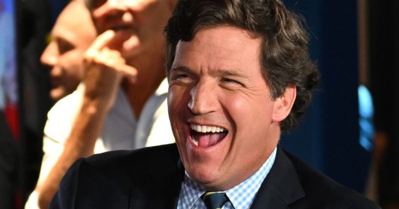 Tucker Carlson laughs during the Fox Nation Patriot Awards at the Seminole Hard Rock Hotel & Casino in Hollywood, Florida, on Nov. 17, 2022.