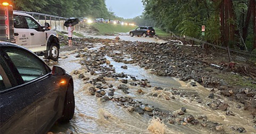 Vehicles come to a standstill near a washed-out and flooded portion of the Palisades Parkway just beyond the traffic circle off the Bear Mountain Bridge in Orange County, New York, on Sunday.