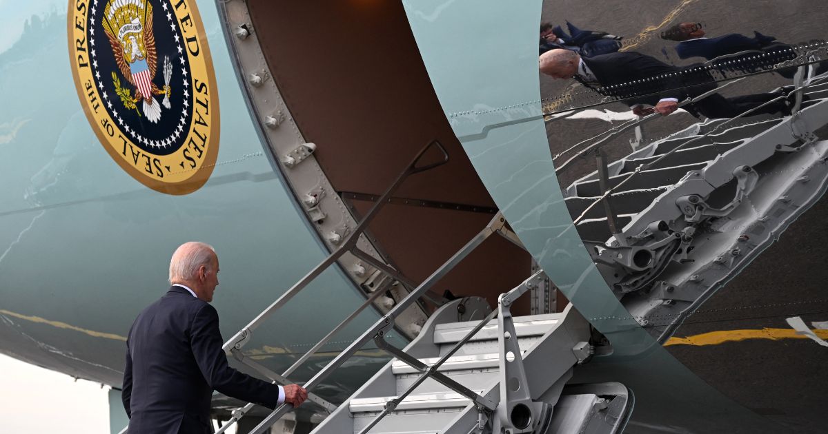 US President Joe Biden boards Air Force One as he departs from the Vilnius International Airport in Vilnius, Lithuania, on July 12, 2023, after the end of NATO Summit.