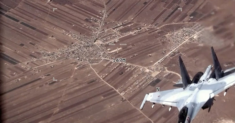 In this image from a video released by the U.S. Air Force, a Russian Su-35 flies near a U.S. Air Force MQ-9 Reaper drone on July 5, over Syria.