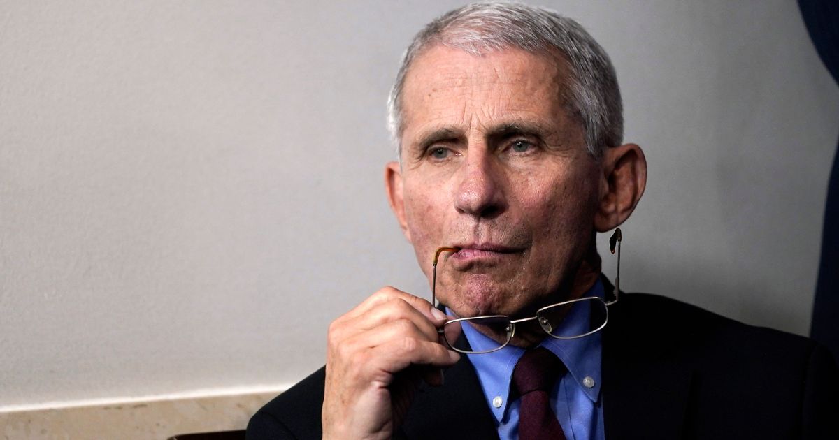 Anthony Fauci listens during a briefing on the coronavirus pandemic in the press briefing room of the White House on March 27, 2020 in Washington, DC.