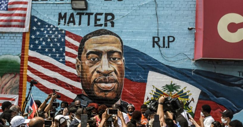 A mural painted by artist Kenny Altidor depicting George Floyd is unveiled on a sidewall of CTown Supermarket on July 13, 2020, in the Brooklyn borough New York City.