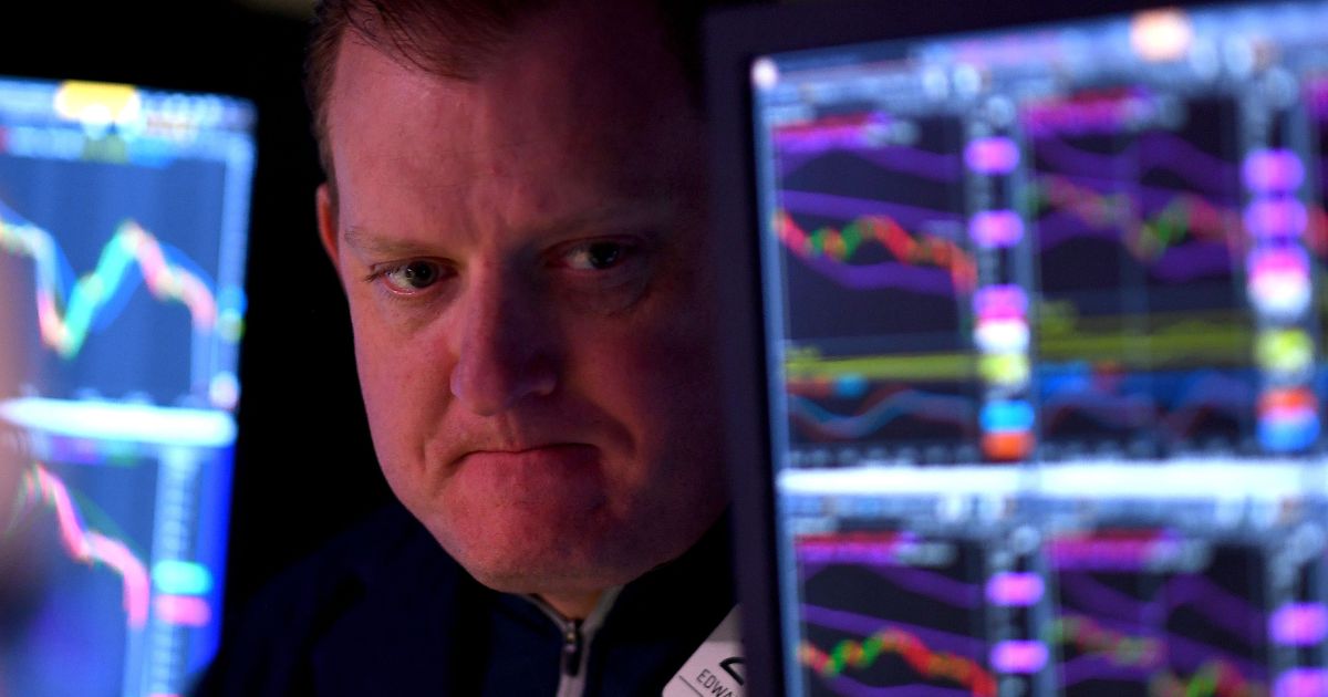 Traders work during the opening bell at the New York Stock Exchange (NYSE) on February 28, 2020 at Wall Street in New York City.