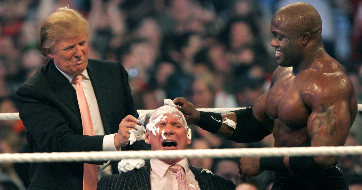 WWE chairman Vince McMahon, center, has his head shaved by Donald Trump, left, and Bobby Lashley, right, after losing a bet in the Battle of the Billionaires at the 2007 World Wrestling Entertainment's Wrestlemania at Ford Field on April 1, 2007 in Detroit, Michigan.