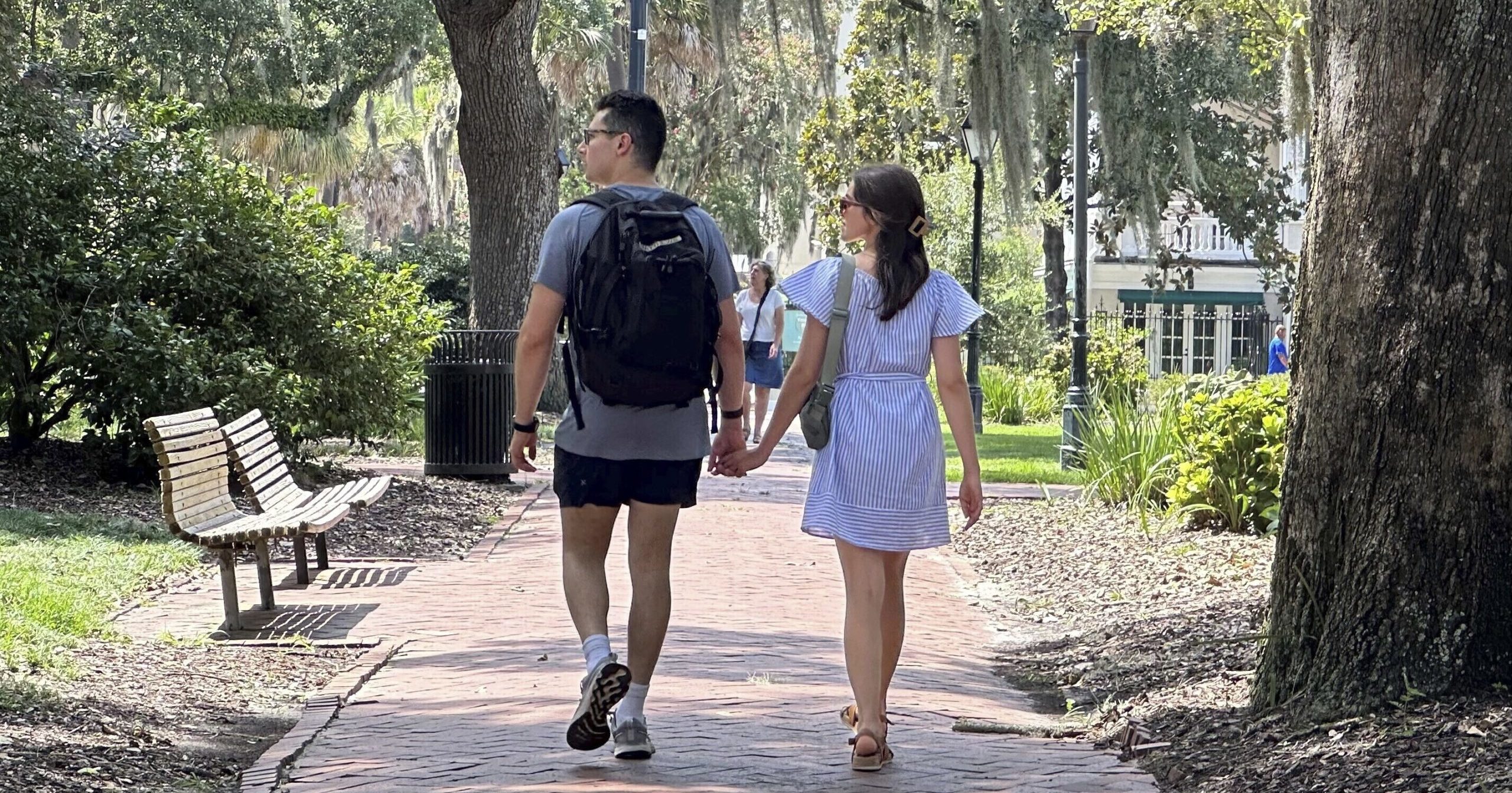 People stroll through the park formerly known as Calhoun Square in Savannah, Georgia, on Wednesday.