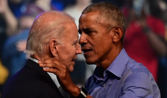 President Joe Biden, left, and former President Barack Obama, right, embrace on stage during a rally for then Pennsylvania Democratic Senate nominee John Fetterman in Philadelphia, Pennsylvania, on Nov. 5, 2022.