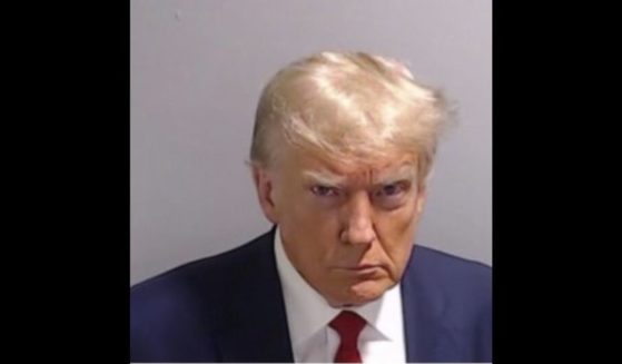 Former President Donald Trump shared his mugshot on Thursday in his first post on X since Jan. 8, 2021.