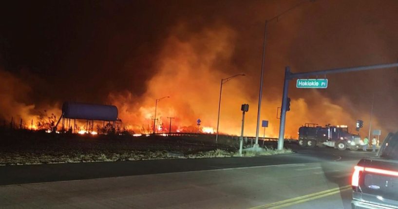 Fire and smoke fill the sky over the intersection of Hokiokio Place and Lahaina Bypass in Maui, Hawaii, on Aug. 8.