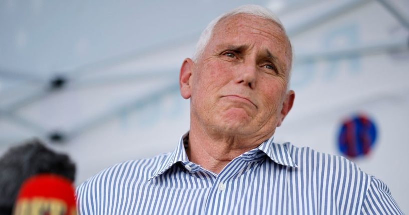 Republican presidential candidate and former Vice President Mike Pence talks to reporters at the Iowa State Fair on Aug. 10 in Des Moines, Iowa.