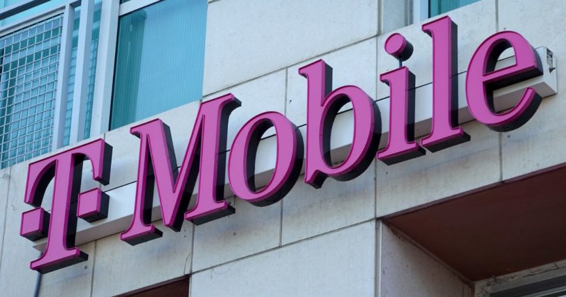 A T-Mobile sign hangs outside of a store in Miami, Florida, on Feb. 1.