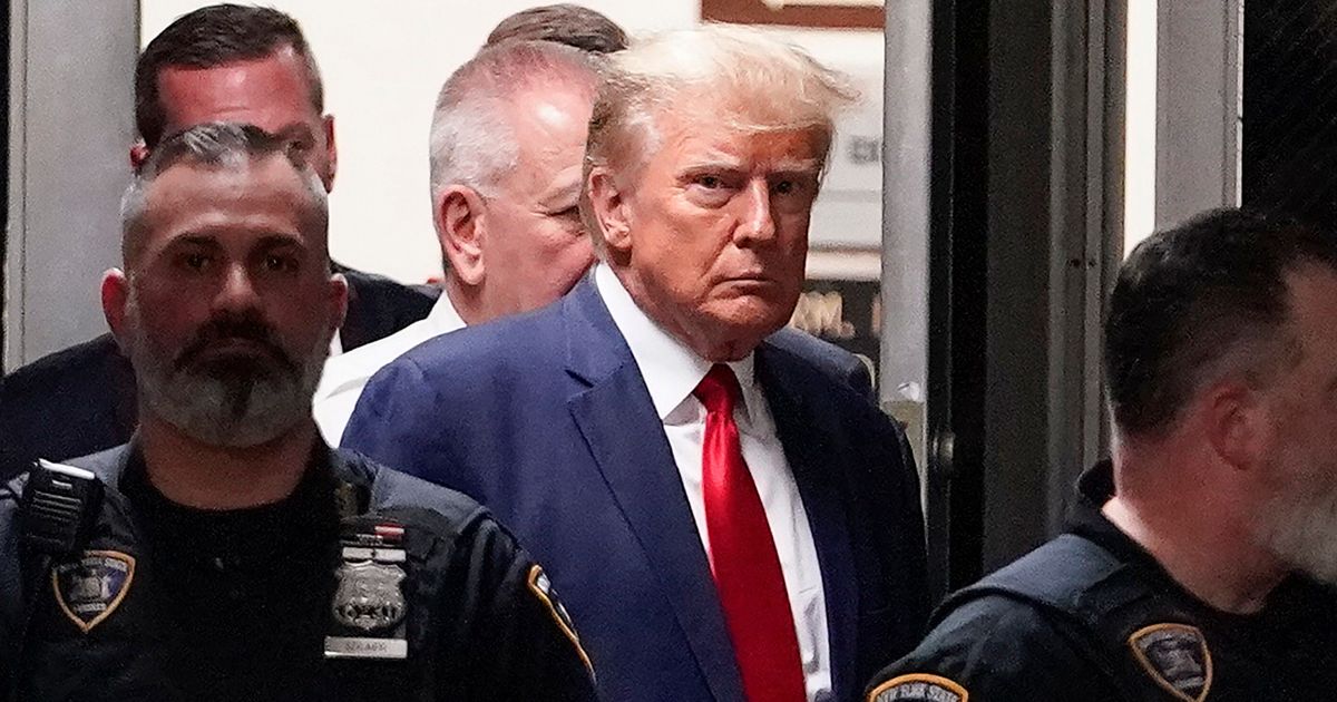 Former President Donald Trump is escorted to a courtroom in New York City on April 4.