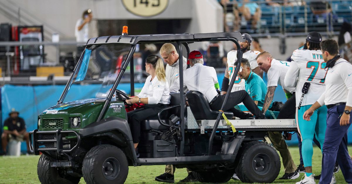 Miami Dolphins wide receiver Daewood Davis is taken off the field on a cart during the second half of an NFL preseason football game against the Jacksonville Jaguars on Saturday in Jacksonville, Florida.