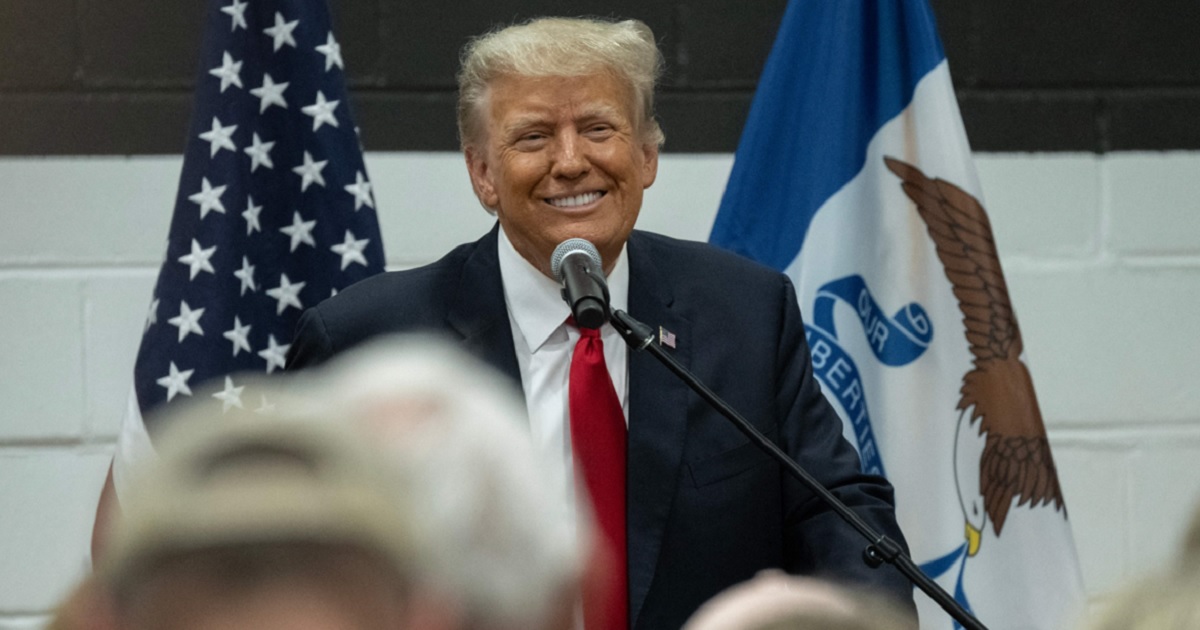 Former President Donald Trump smiles during a volunteer training workshop in  in Grimes, Iowa, on June 1.