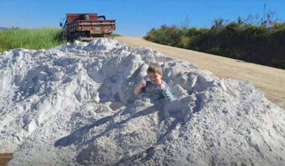 In a Facebook post, 7-year-old Arthur Emanuel Bitencourt was seen playing in a pile of limestone just minutes before his tragic death, which was caused by inhaling too much limestone.