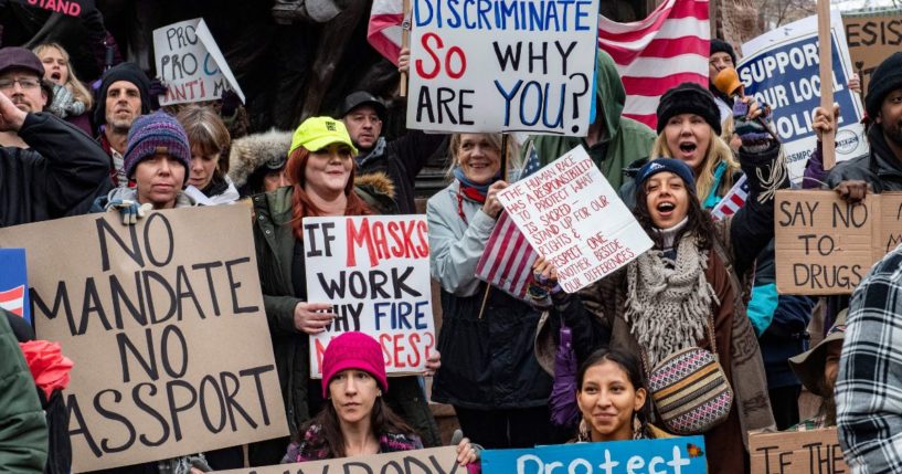 Demonstrators protest masks, vaccine mandates and vaccine passports at the State House in Boston on Jan. 5, 2022.