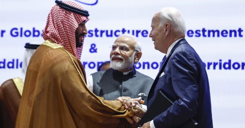 Saudi Arabian Crown Prince Mohammed bin Salman Al Saud, left, and President Joe Biden, right, shake hands next to Indian Prime Minister Narendra Modi at the G20 summit in New Delhi, India.